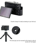 Beefy Solid Metal Hand Grip Bracket With Anti Slip Pads For Sony RX100 VII RX100M7 Camera shown with fold-out screen and tripod socket.