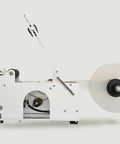Heavy Duty Semi Auto Round Bottle Labeler For 15 To 120 Mm Containers Runs Like Clockwork At Forty Labels Per Minute featuring smooth feed reel.