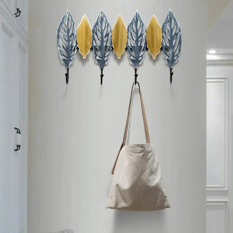 Slick Wall Mounted Coat Rack Heavy Duty Steel Hooks For Entryway Door Hallway Closet with leaf design and bag hanging.