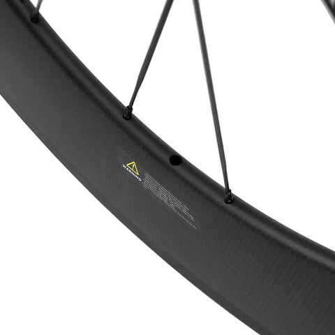 Close-up of Carbon Road Wheelset 700c Matte Finish Clincher With 88mm Rim Brake showing basalt braking surface and spokes.