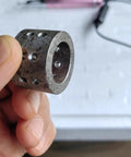Ultra Mini Electric Micro Hole Internal Chamfering Machine Deburring Tool with Diamond Grinding Head, showing a metal cylindrical piece.