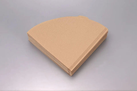 V60 Size 02 Cone Coffee Filters Natural 100 Count Box for Pour Over Brews, shown in a stack, fits cone drippers perfectly.