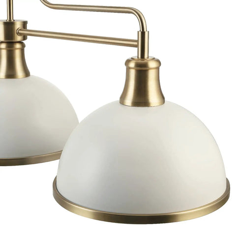 Close-up of Three Light Linear Chandelier in Matte White with Brass Accents, elegant domes highlighting modern design.