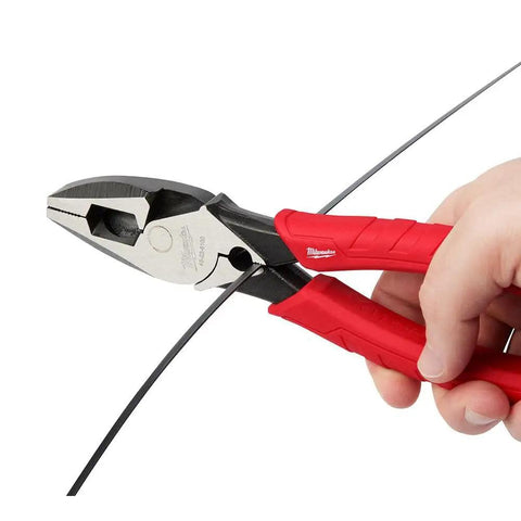 Using 9 Inch Leverage Lineman Pliers With Crimper And Pipe Reaming Head to cut wire, showcasing red rubberized grip handles