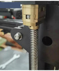 Upgrade Your 3D Printer Setup With Premium T8 Z Axis Lead Screw Parts Featuring Durable Brass Oldham Coupling And Flexible Hot Bed Fitment Perfect For Ender 3 Models With 18mm Thread Hole Grey Finish That Works Like A Charm. Close-up of brass T8 Z-axis lead screw on Ender 3 mount
