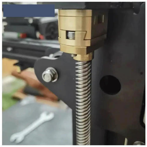 Upgrade Your 3D Printer Setup With Premium T8 Z Axis Lead Screw Parts Featuring Durable Brass Oldham Coupling And Flexible Hot Bed Fitment Perfect For Ender 3 Models With 18mm Thread Hole Grey Finish That Works Like A Charm. Close-up of brass T8 Z-axis lead screw on Ender 3 mount