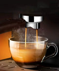 4 Cup Drip Coffee Maker with Timer and Thermal Carafe brewing steamy coffee into a glass cup, showcasing rich extraction.