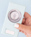 Hand holding Layering Circle Punch Set In Three Pieces For Crafts Create Dimensional Texture With One And A Half Inch One Inch And Five Eighths Inch Circles Ideal For Card Making Scrapbooking And Diy Projects close-up