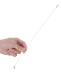 Hand holding a round nichrome heating wire for the Four Piece Round Heat Sealer Heating Wire Replacement Strips.