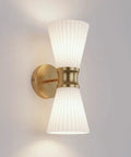 JAZAVA 2-Light Up Down Wall Sconce, Frosted Pleated Glass, Pale Brass with ribbed glass shades and brass mount.