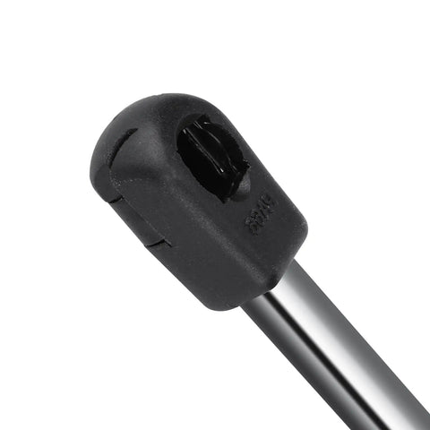 Close-up of a Volkswagen Jetta rear trunk lift support strut end fitting, part of the 710N gas springs 2 pack for 2005-2010 models.