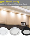 Under Cabinet LED Puck Lights 12V 2W Each in a Sweet Six Pack showcasing black, silver, and white finishes in a modern kitchen setting.