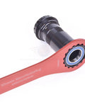 Pro Grade 16 Notch Bottom Bracket Wrench 44 To 48 Millimeter For Bike Maintenance Red tool engaging bike crankset