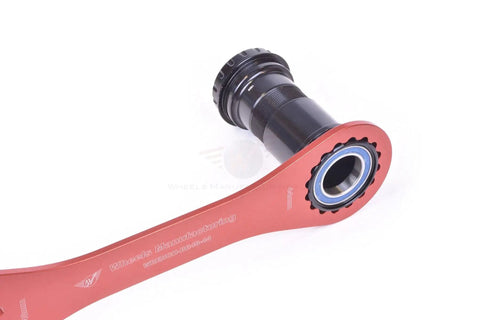 Pro Grade 16 Notch Bottom Bracket Wrench 44 To 48 Millimeter For Bike Maintenance Red tool engaging bike crankset
