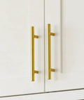 50 Pack Brushed Brass Cabinet Pulls 3 3/4 Inch Long, Satin Gold Kitchen Drawer Handles installed on white cabinet doors