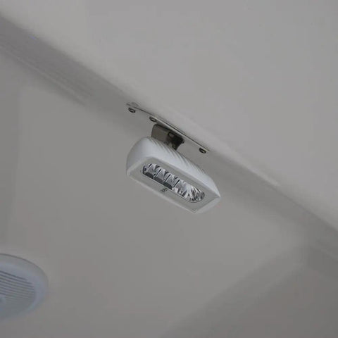 CapreraLT LED Cockpit Flood Deck Light With Bracket Mount installed on ceiling, showcasing waterproof IP67 boat lighting.