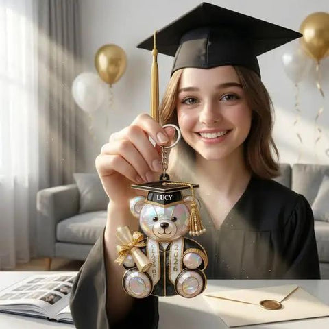 Graduate holding Personalized Graduation Bear Keychain with Custom Name and Class of 2026, a heartfelt keepsake gift.