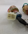 Close-up of 2pcs four position ignition switch with 4-wire connector, 18mm mount for easy installation in vehicles.