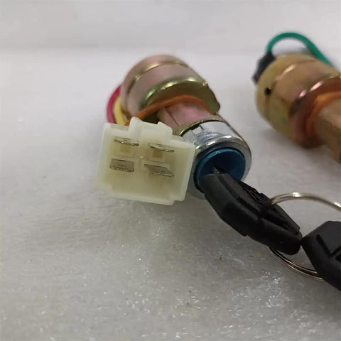 Close-up of 2pcs four position ignition switch with 4-wire connector, 18mm mount for easy installation in vehicles.