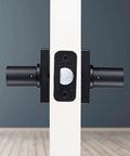 Side view of installed Six Pack Matte Black Indoor Passage Door Levers For Hall And Closet Dope Contemporary Non Locking Reversible Handles Set
