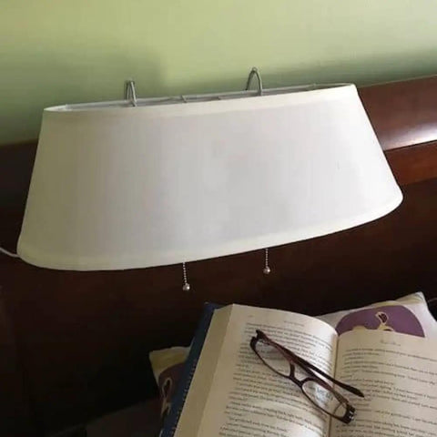 Double Headboard Bed Lamp with fabric shade clipped on headboard, book and glasses below, tool-free rubber hook attachment