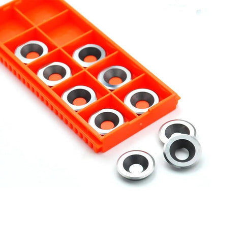 Front view: TANOMATE 16mm round carbide inserts, negative rake, 10 pcs in orange storage tray