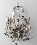 Slick Silver One Light Wall Sconce Featuring A Dang Cool Industrial Design For Fresh Modern Home Decor Boss Quality Sturdy Hardware Fast Mounting Setup Included, artistic curved metal design.
