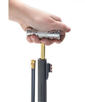 Hand using Ultimate Loading And Cleaning Rod For Guns Range Ready Cleaning Tool For Home Or Field, showing T-handle in use