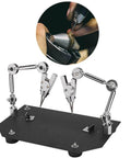 Two Clip Welding Fixture Station With Adjustable Rotating Table Clips For Soldering And Repairs, metal base, in use for detail work