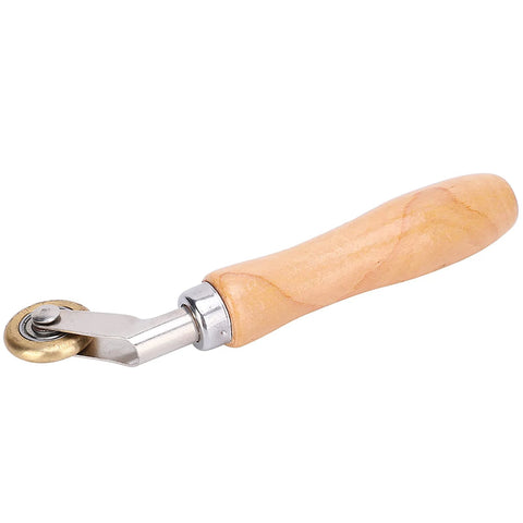 Steel seam roller with wooden handle and brass wheel for roofing membranes and wallpaper seams.