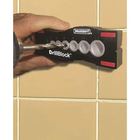 Pro Grade DrillBlock Drilling Guide For Precise Woodworking And Metalworking, Solid Metal Drill Jig in use on a wall