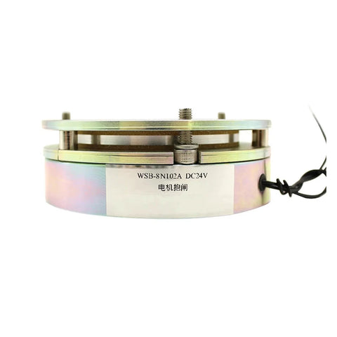 Electromagnetic brake assembly for a small electric lift platform, circular metal housing with label and wiring visible.