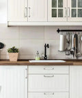Polished Nickel Cabinet Pulls 10 Pack Five Sixteenths Inch Center Hole Cabinet Hardware installed on white kitchen cabinets.