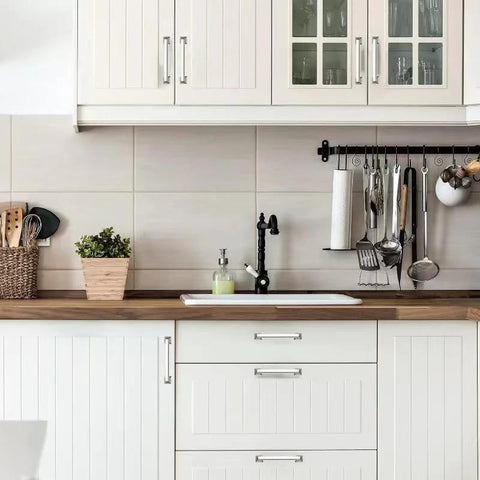 Polished Nickel Cabinet Pulls 10 Pack Five Sixteenths Inch Center Hole Cabinet Hardware installed on white kitchen cabinets.