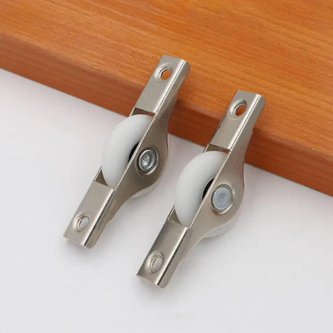8 Pack Rock Hard Nylon Slider Wheel Replacement Pulleys for Walk in Closets Cabinet and Chiller Doors Smooth Rolling Track Upgrade with Easy Peasy Snap Fit Design Durable Abs Build for Hotel and Restaurant Fixups - close-up of metal slider wheels with white nylon rollers.