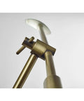Close-up of Vera LED Floor Lamp With Adjustable Height 46.5 To 61 Inches focusing on brass finish and marble accent