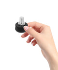 Hand holding 4 Pack Roller Skate Toe Stoppers Replacement Black Honeycomb Rubber Brake Plugs For Quad And Inline Skates Durable Wear Resistant Brake Parts Built For Outdoor And Indoor Skating Safety