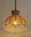 YNAHZAOK Hand-Woven Jute Rope Pendant Light Wrapped Iron Frame Hanging Lamp with Natural Hemp Rope Cord rustic design illuminating space.