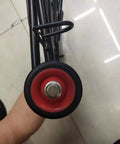 Close-up of wheel from Foldable Lightweight Two Wheel Shopping Cart Dolly With Easy Open Design Portable Hand Truck Utility Trolley.