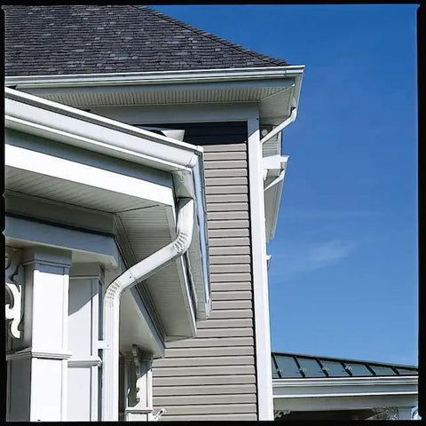 Side view of house with gutters attached using White Gutter Screws For 5 Inch And 7 Inch Gutters, 10 Pack, Set Of 3.