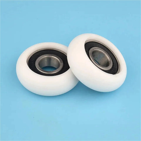 Two Ten Pack 6202RS Circular Arc Pulleys With Plastic Coated Polyamie Nylon Bearings for heavy duty machinery on blue background.