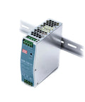 Hard As Nails 150W 24V Din Rail Power Supply with a sleek silver design mounted on a standard rail for industrial use.