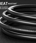 Close-up of coiled 6 Ft Replacement Power Cord For Popular Electric Pressure Cookers And Rice Cookers, heat resistant, black