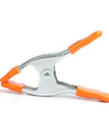 2 Inch Spring Clamp With Handle One Handed Clamping Tool Silver Orange Finish Quick Release Paddle Action for Woodworking and DIY Projects Workhorse Grip Control angled view