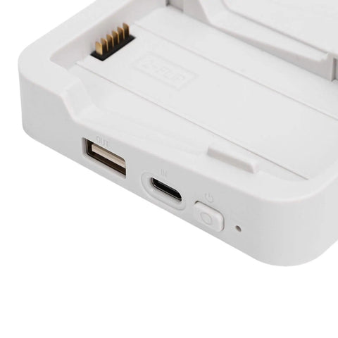Close-up view of a Two Way Drone Battery Charger with 60W Fast Charging Storage Station On The Go with USB ports and buttons visible.