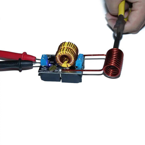 5 to 12 Volt DC ZVS Induction Heating Power Supply Module with Coil for DIY electronics projects, showing coil and power connections.