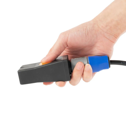 Hand holding nozzle of Paintless Dent Repair Kit With 1380W Induction Heater Pro PDR Tool Set In Magnetic Case Portable Auto Body Induction Repair Machine On The Go For Home Or Shop Suitcase Style Dent Removal Kit.