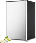 Sleek 3.2 Cu Ft Upright Mini Freezer With Adjustable Removable Shelves And Dope Silver Cabinet with lime slices and ice cubes.