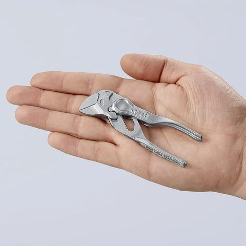 Pliers Wrench XS 4 Inch One Hand Quick Adjust Pliers in hand, showing size and silver color, for gripping with parallel jaws.