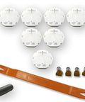 Seven white GM stepper motor repair modules labeled X27 168 with orange removal tool and small brown adapters